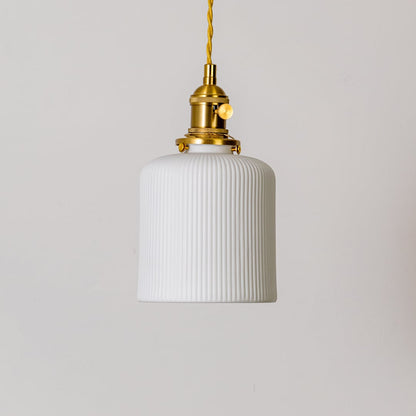 Ribbed white glass pendant light with gold metal holder shown on white background for modern home interior decor.