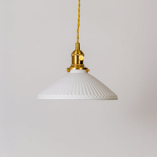 Ribbed white glass pendant light with gold metal holder displayed on white background for modern kitchen dining decor.