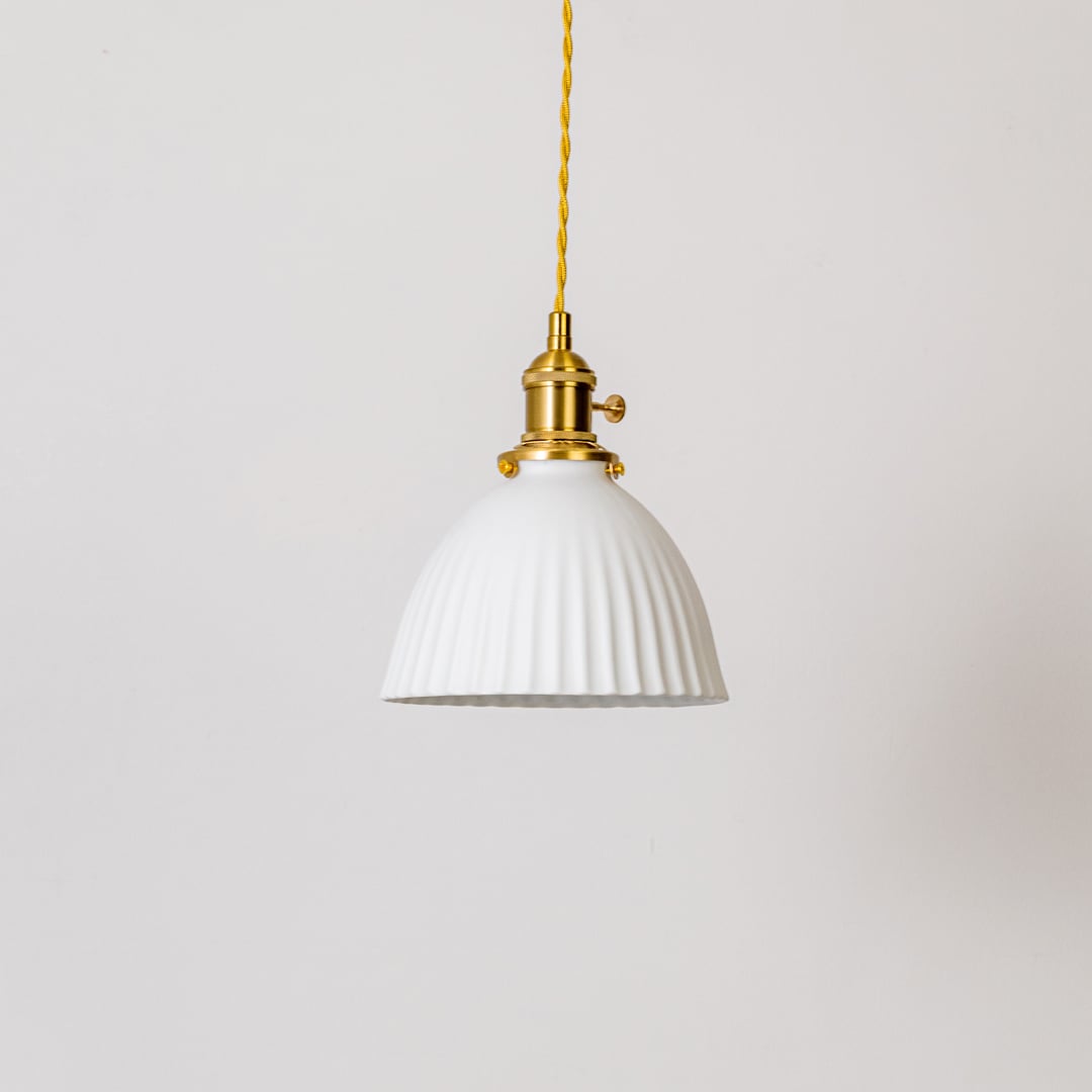 Fluted white glass pendant light with gold metal holder shown on white background for modern kitchen dining home decor.