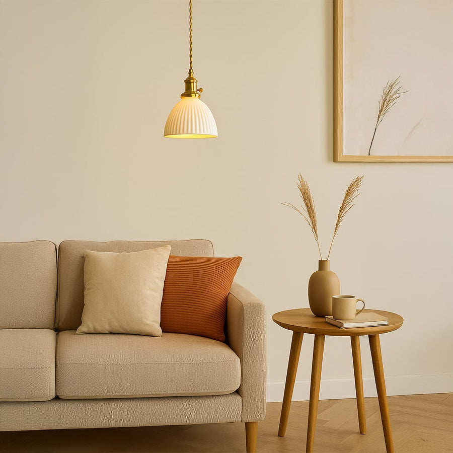 Fluted white glass pendant light with gold metal holder adding elegant warm style to living room dining room and home decor.