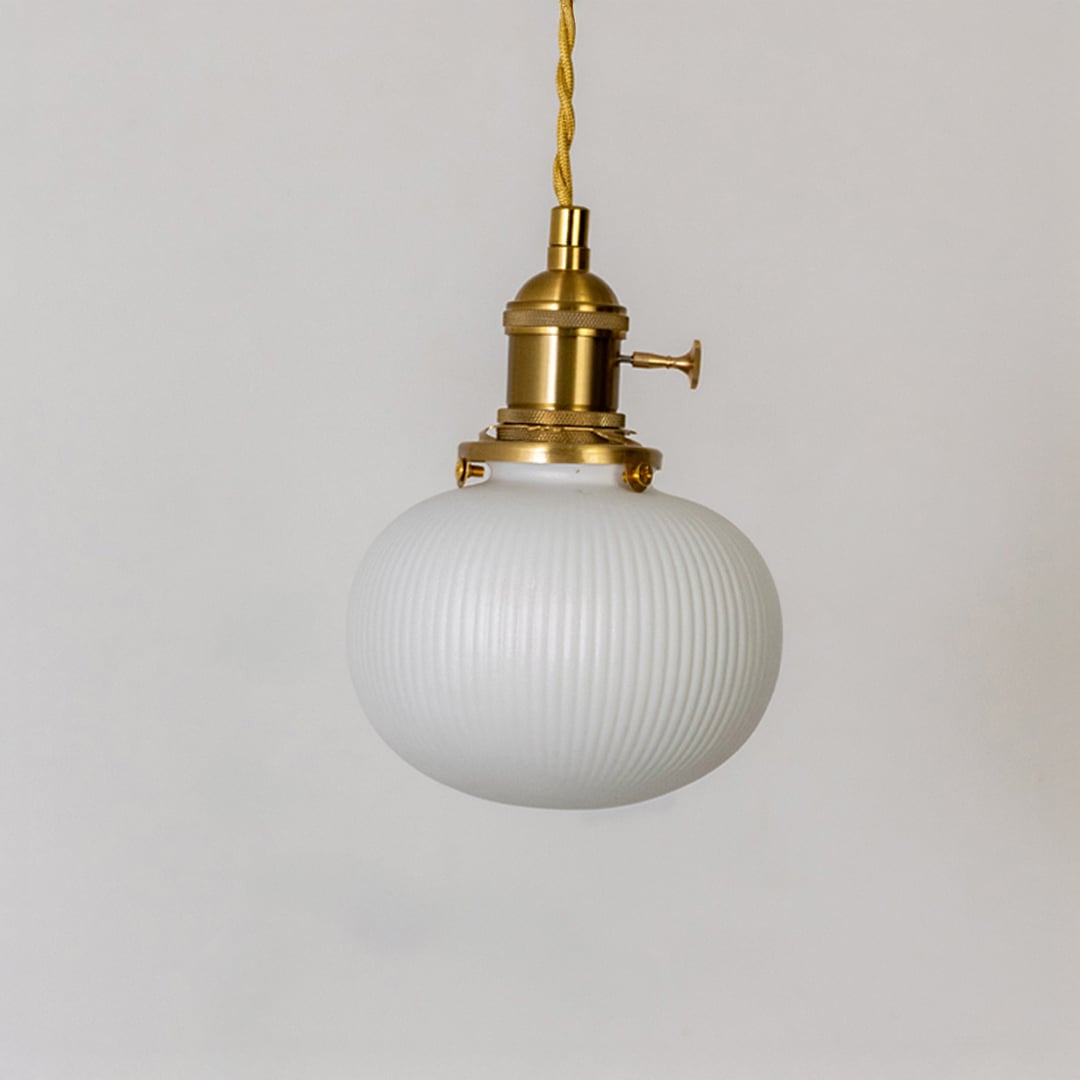 Round ribbed white glass pendant light with gold metal holder displayed on white background for modern kitchen dining decor.