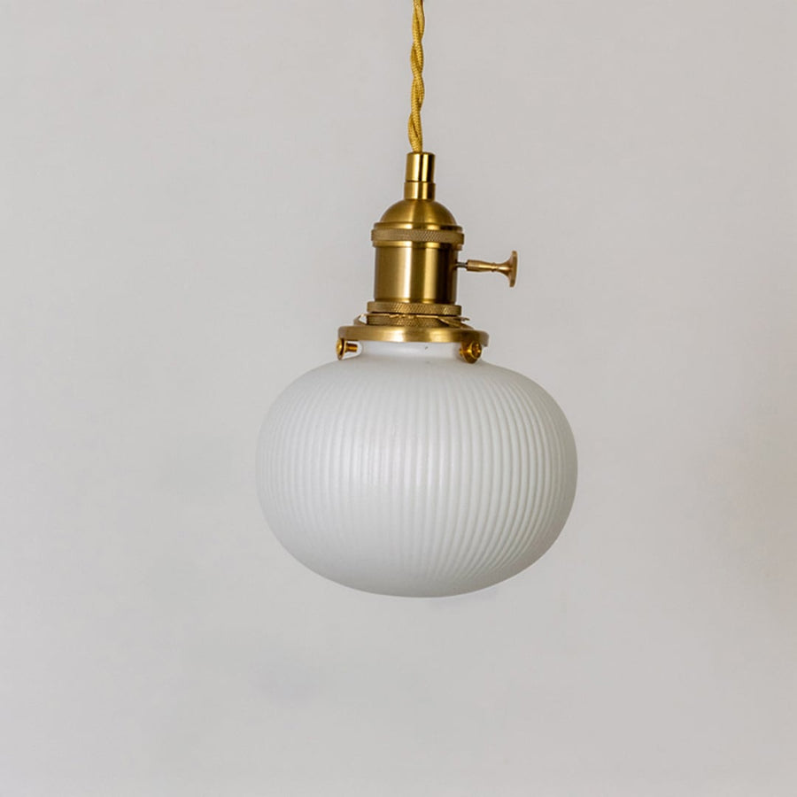 Round ribbed white glass pendant light with gold metal holder displayed on white background for modern kitchen dining decor.