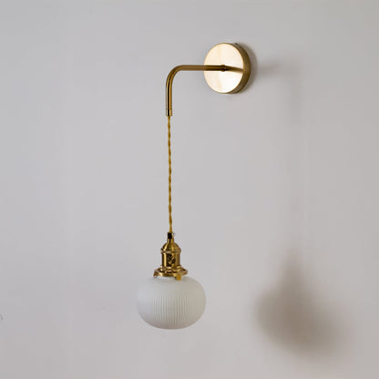 Gold metal wall light with white ribbed globe shade shown switched off on white background for minimal stylish decor.