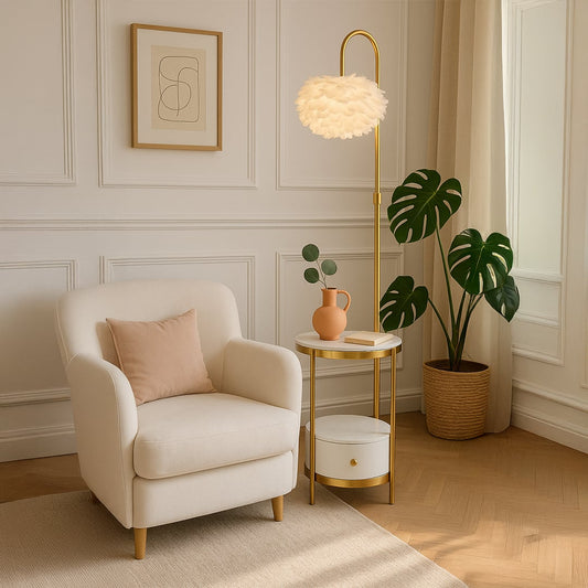 Feather shade gold floor lamp with side table and drawer turned on styled beside armchair in cozy living room.