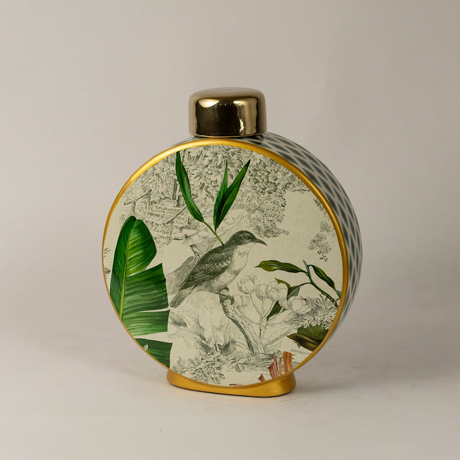 Side angle of tropical bird jar showing glossy round shape with tropical foliage and bird artwork.