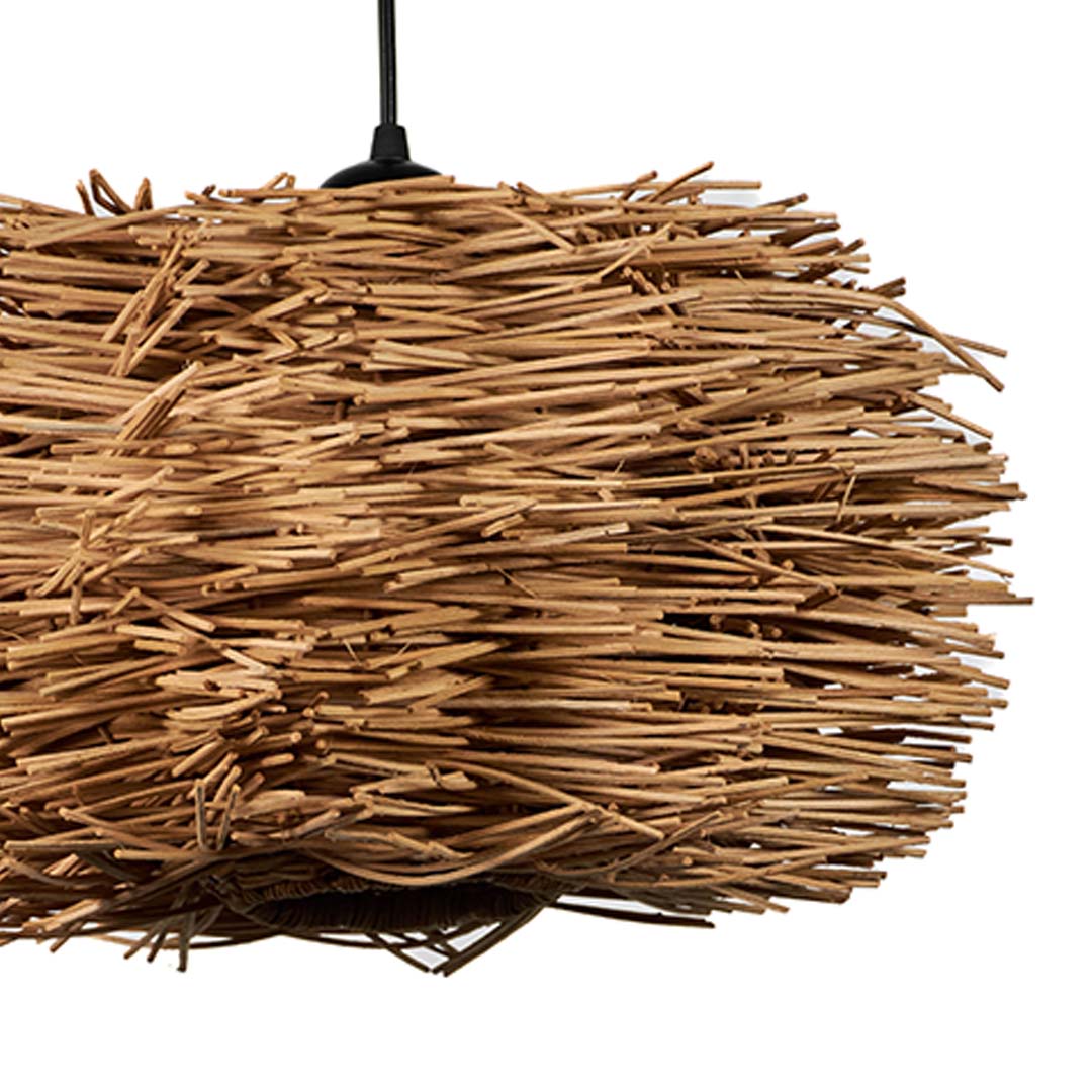 Closeup of rattan twig pendant light highlighting intricate handwoven texture and natural craftsmanship.