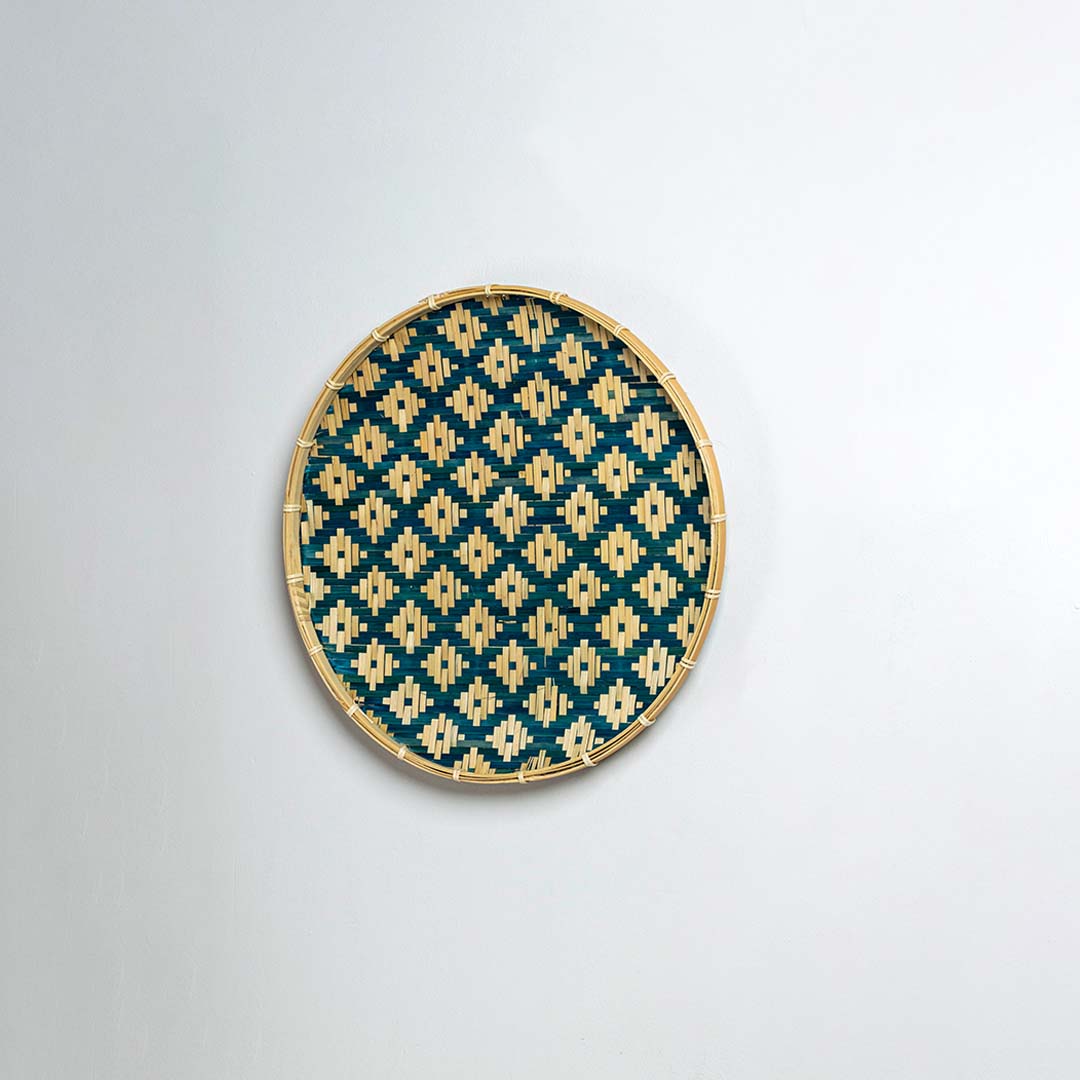 Side view of bamboo wall decor plate showcasing its raised rim smooth weave texture and sturdy handcrafted frame.