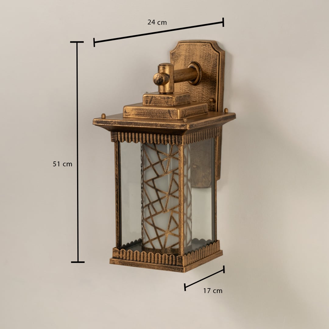 Gold metal outdoor lantern with patterned glass shown with 51 cm height 24 cm width and 17 cm depth offering accurate sizing for exterior installation.