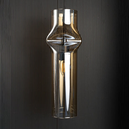 Chrome pendant light turned off reflecting soft highlights against dark backdrop highlighting its elegant industrial design.