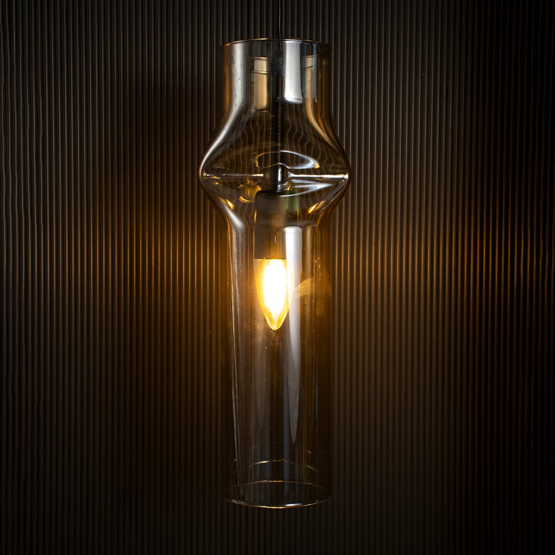 Chrome pendant light on white background showcasing sleek cylindrical design with reflective silver finish.
