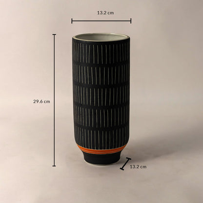 Black ceramic vase with white striped design and orange accent shown with 29.6 cm height and 13.2 cm diameter dimensions.
