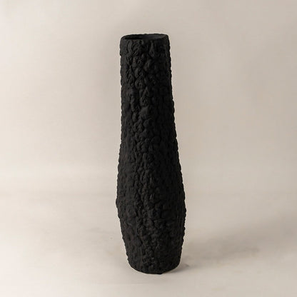 Contemporary tall black ceramic vase with handcrafted textured finish styled for minimal living room and office interiors.
