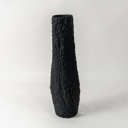 Elegant tall black textured ceramic vase ideal for contemporary shelf and corner decoration on plain white background surface.