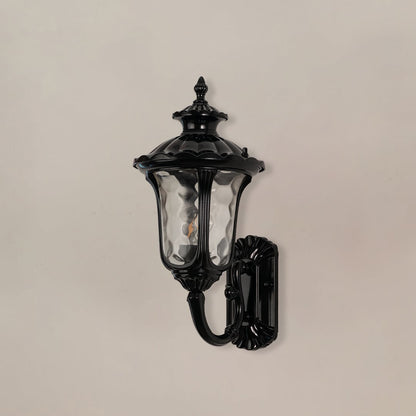 Black outdoor wall lantern displayed on white background with light off showing textured glass and sturdy outdoor frame.