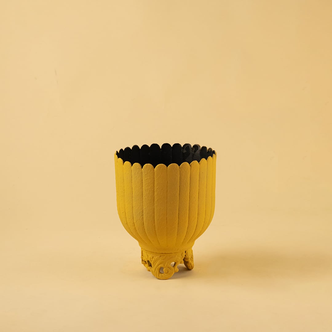 Yellow metal scalloped planter decor on a clean white background highlighting its bold textured finish for versatile home styling.