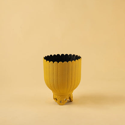 Yellow metal scalloped planter decor on a clean white background highlighting its bold textured finish for versatile home styling.