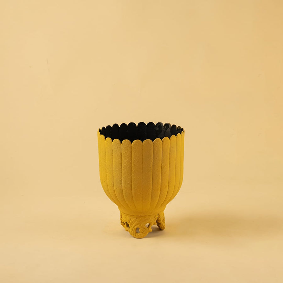 Yellow metal scalloped planter decor on a clean white background highlighting its bold textured finish for versatile home styling.