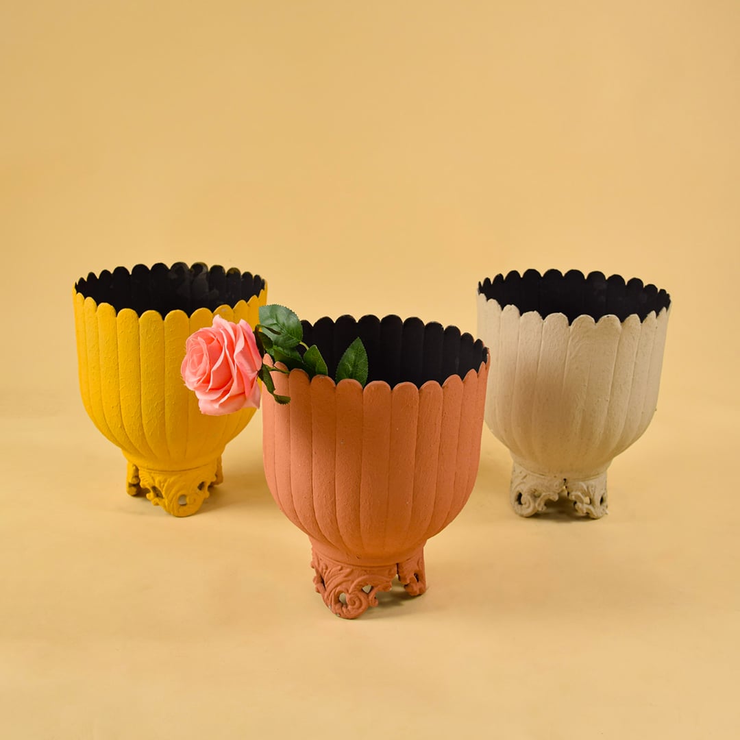 Terracotta metal scalloped planters displayed together creating an earthy modern decor look ideal for shelves centre tables and consoles.