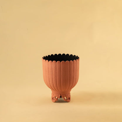 Terracotta metal scalloped planter decor on a clean white background highlighting its warm textured finish for versatile home styling.