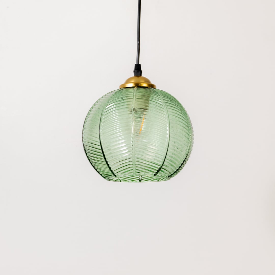 Green ribbed glass and gold metal pendant light designed for elegant dining room and kitchen interiors.
