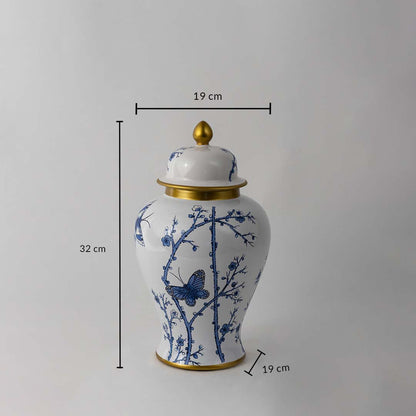 Blue and white ceramic jar with butterfly and floral artwork shown with 32 cm height and 19 cm width dimensions