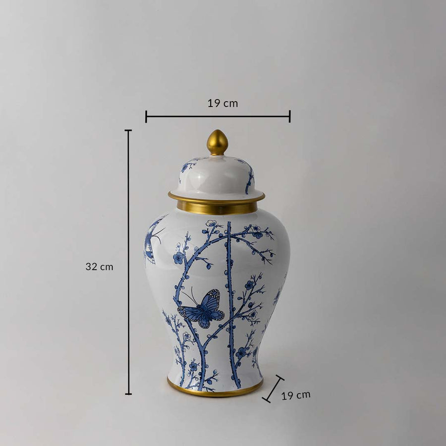 Blue and white ceramic jar with butterfly and floral artwork shown with 32 cm height and 19 cm width dimensions