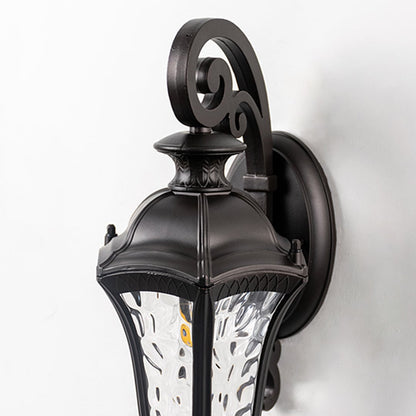 Closeup of lantern wall light with textured glass panels and detailed curved arm showcases fine craftsmanship.