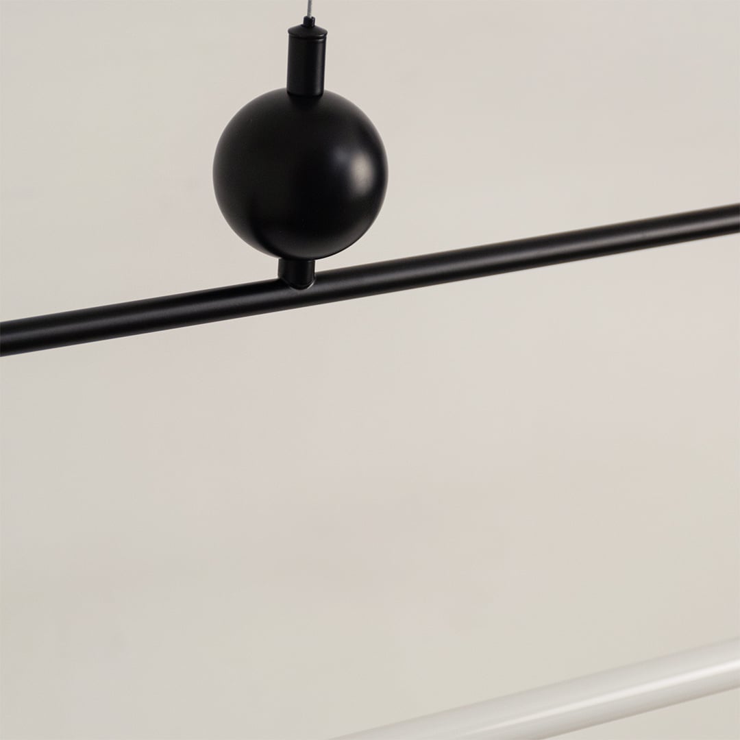 Black metal linear LED pendant light showcasing minimalist detailing and premium craftsmanship for modern ceiling lighting.