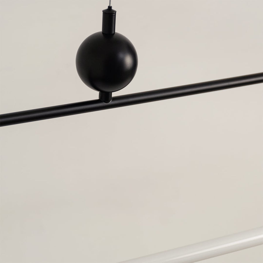 Black metal linear LED pendant light showcasing minimalist detailing and premium craftsmanship for modern ceiling lighting.