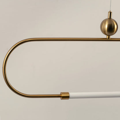 Detailed closeup of gold linear pendant light showing smooth metal finish rounded corners and white diffuser tube.
