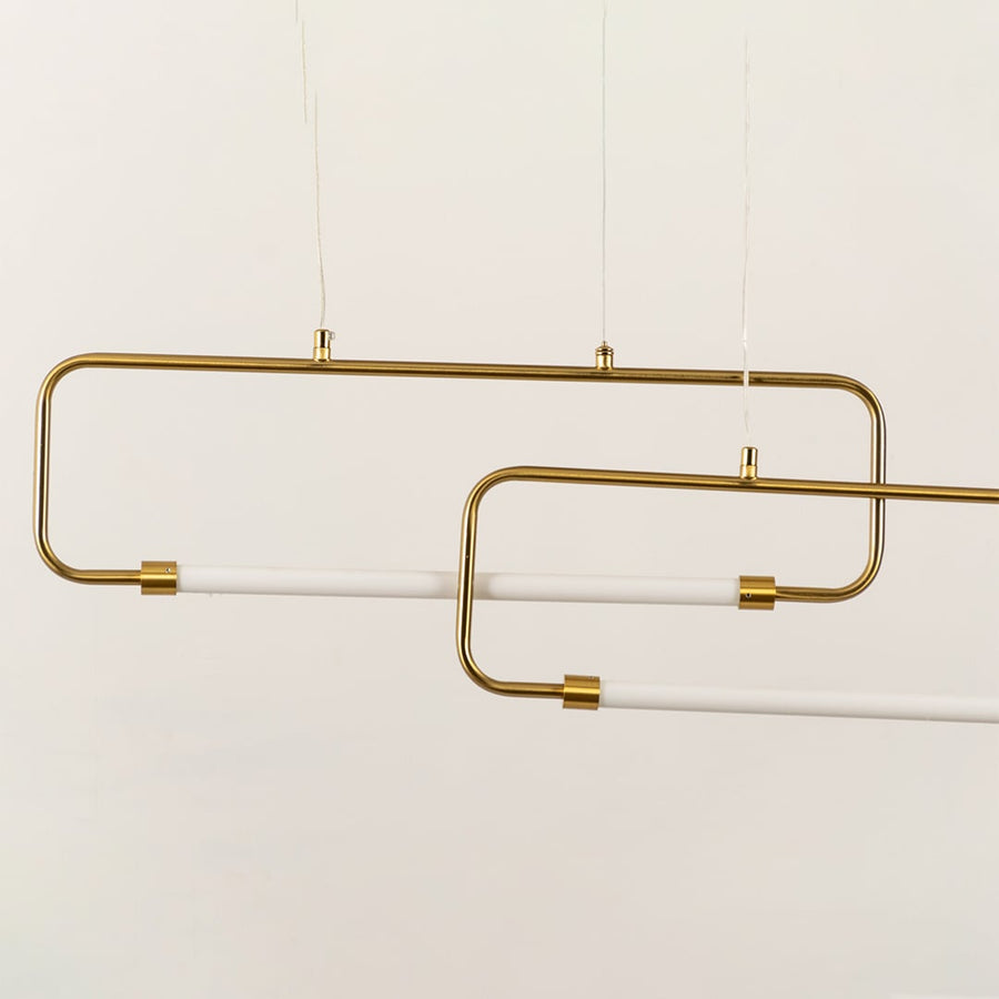 A gold geometric ceiling light with rectangular loops ideal for modern LED chandelier décor and contemporary designer lighting in elegant interiors.