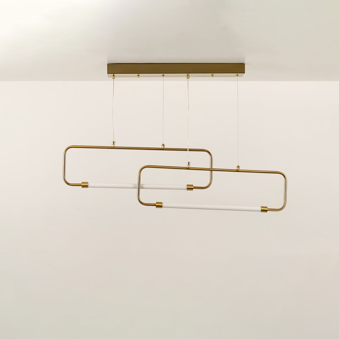 Designer gold metal linear pendant light with sculptural form displayed unlit on black background for premium interior ceiling styling.