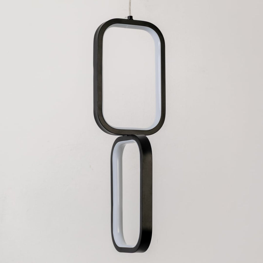 Closeup of black and white metal dual frame hanging light showing smooth finish and premium modern design detailing.
