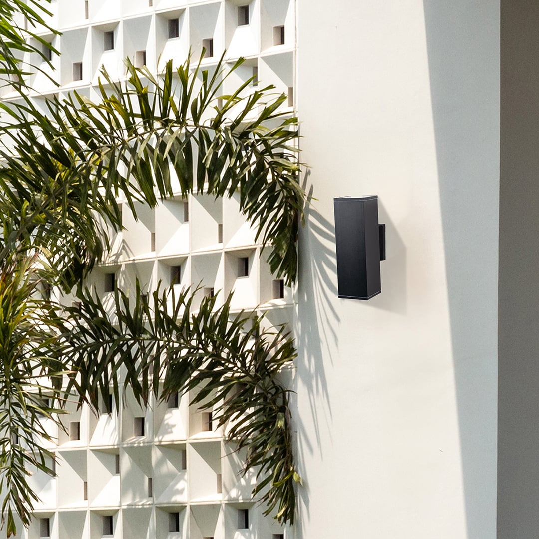 Contemporary black wall light creating a clean modern accent with subtle up and down lighting effect.