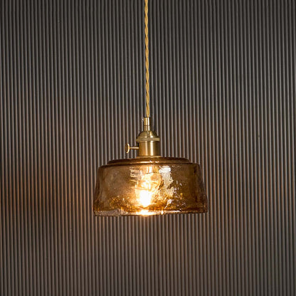 Amber glass pendant light glowing on black background highlighting warm illumination through textured vintage industrial shade.
 RetryClaude can make mistakes. Please double-check responses. Sonnet 4.5