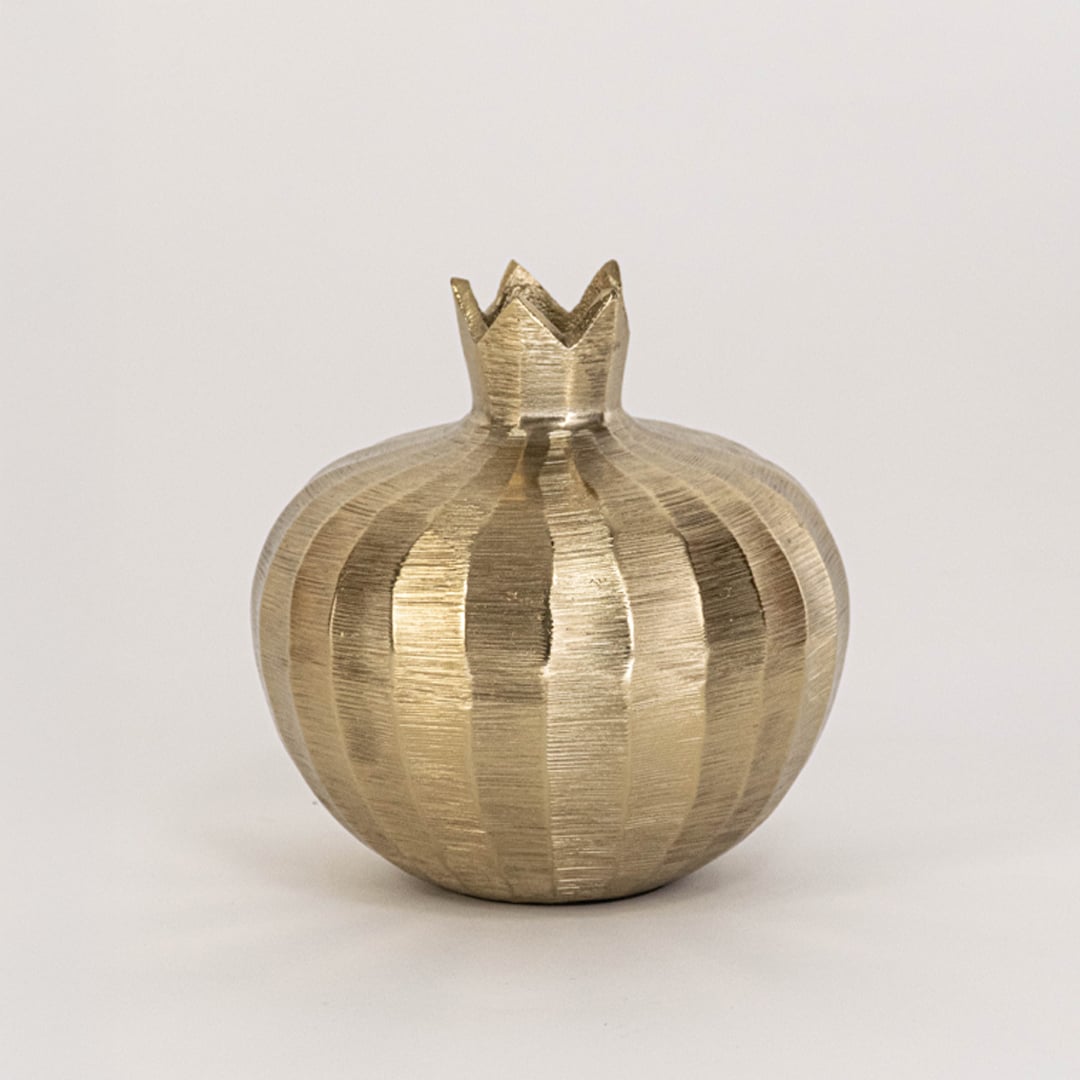 Gold metal pomegranate decor with crown top and textured finish ideal for tabletop accent or festive modern styling