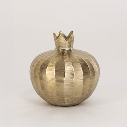 Gold metal pomegranate decor with crown top and textured finish ideal for tabletop accent or festive modern styling