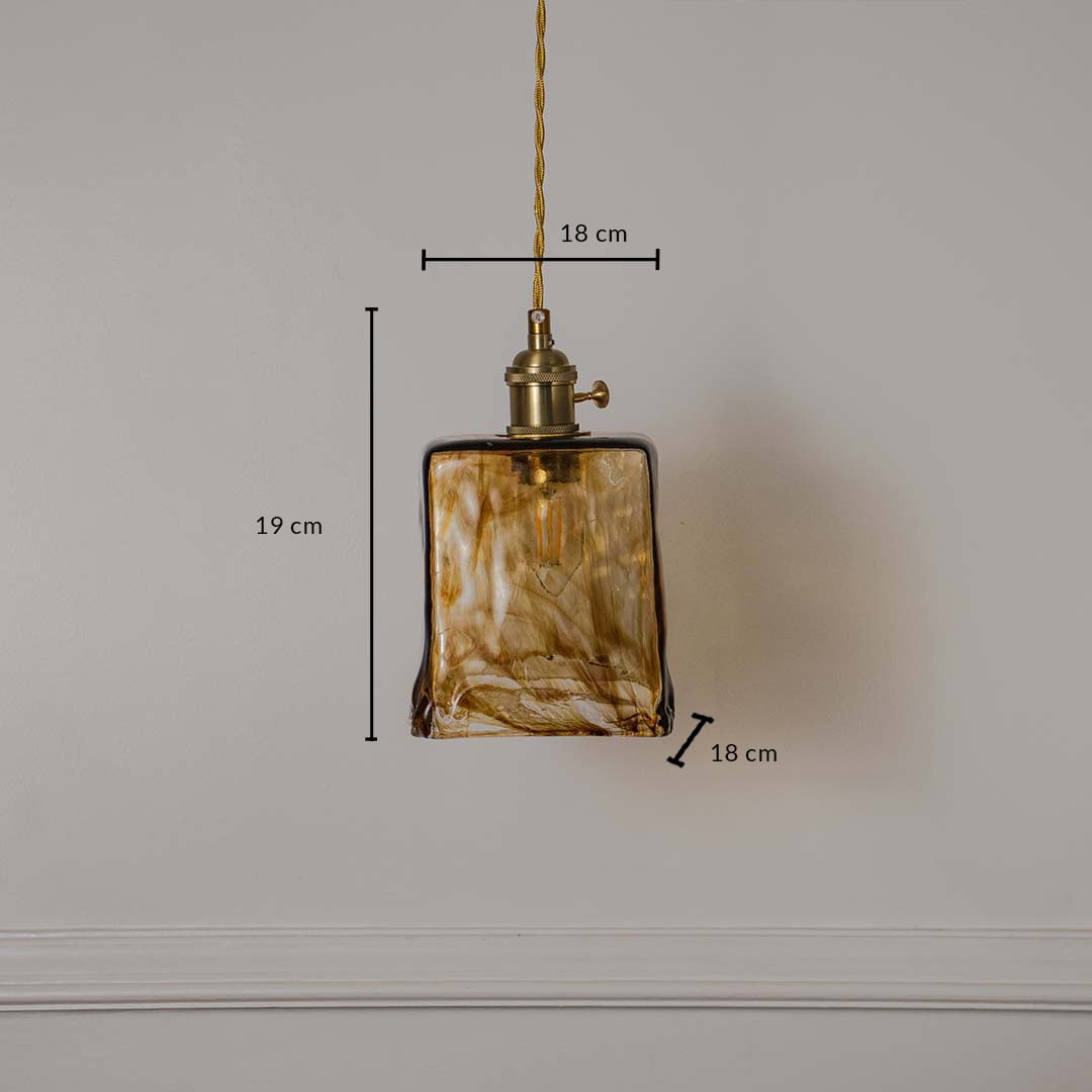 Dimension image of amber marbled square glass pendant light with brass accents showing 19 cm height and 19 cm width.