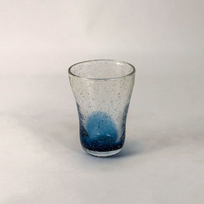 Handcrafted blue gradient vase with textured bubble effect and transparent top placed on a white background.