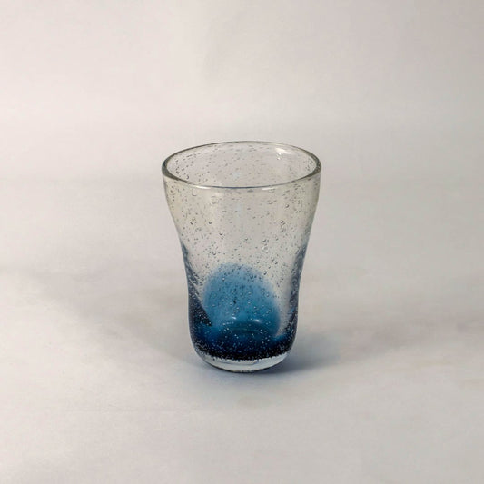 Handcrafted blue gradient vase with textured bubble effect and transparent top placed on a white background.