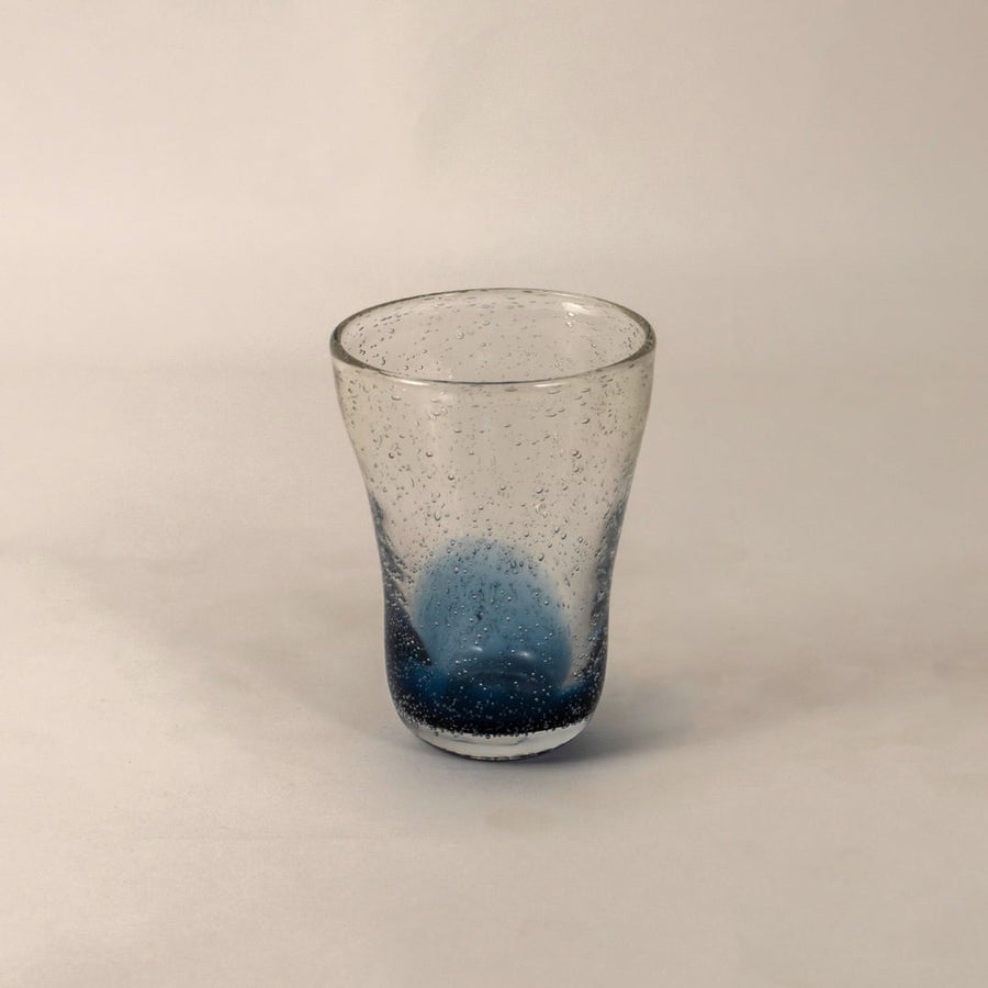 Elegant blue and clear glass vase featuring a modern tapered shape and artistic air bubble detailing.