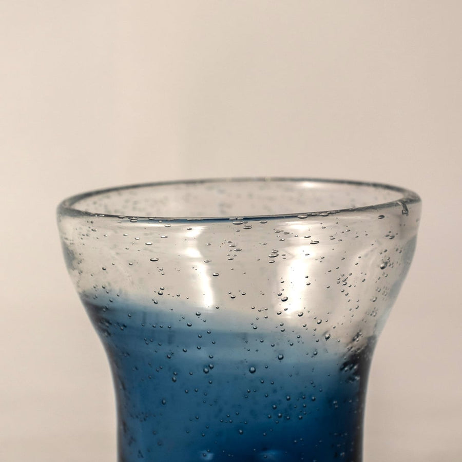 Closeup of blue bubble glass vase showing its handcrafted texture  air bubble detailing  and smooth glossy finish.