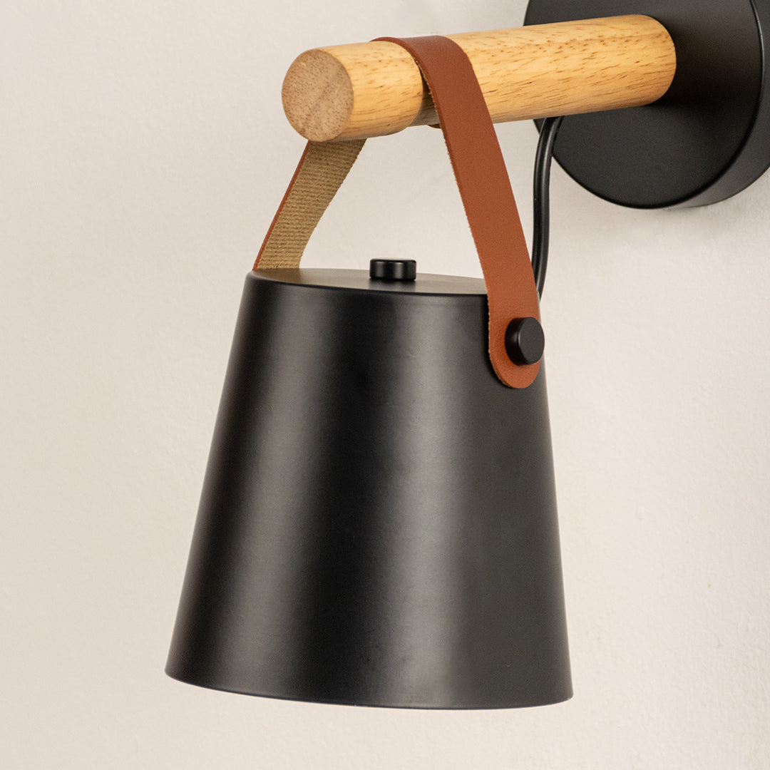 Modern black metal spotlight wall light with wooden accents for stylish contemporary interior decor.