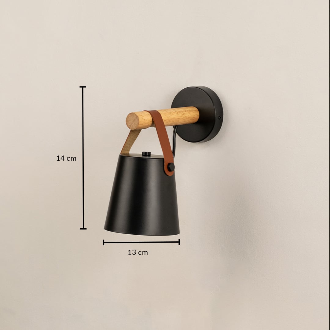 Black metal wall light 14 cm tall and 13 cm wide shown for size reference perfect for bedroom or hallway lighting.