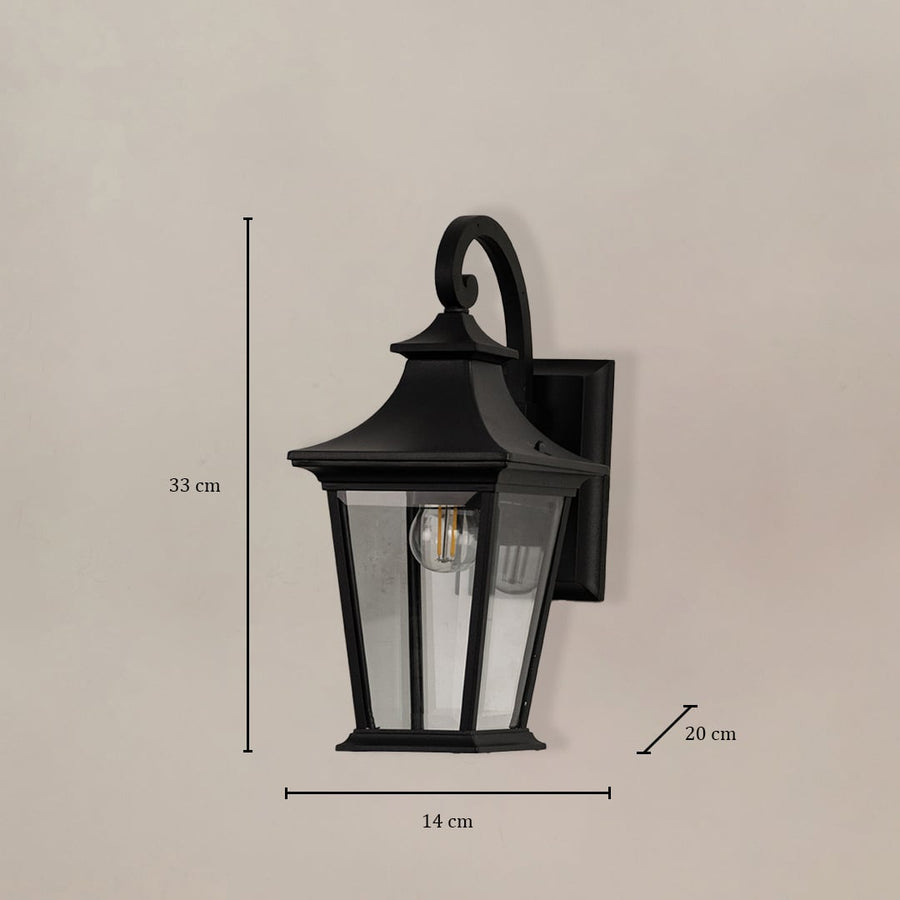 Black metal outdoor wall lantern with clear glass panels showing 33 cm height 14 cm width and 20 cm depth.