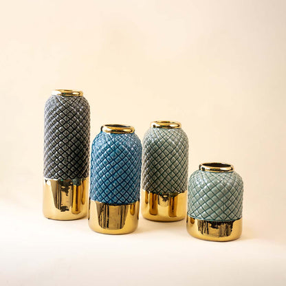 Set of green and blue ceramic decor vases with textured finish and gold base accents ideal for modern table styling on clean background.
