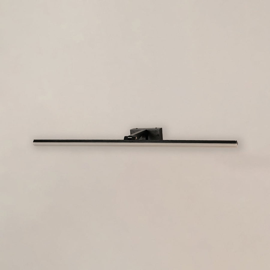 Black metal picture light on a white background with the light off highlighting its minimal modern design.