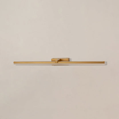 Gold metal picture light on a white background with the light off highlighting its minimal modern design.