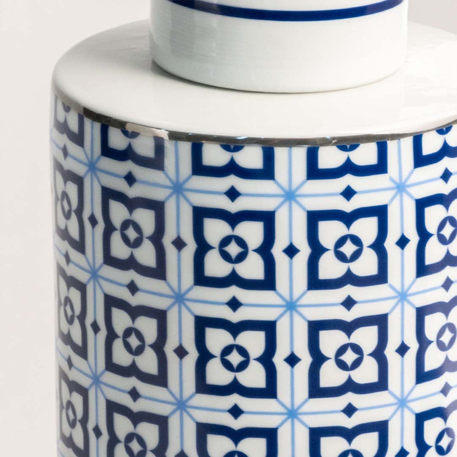 High quality ceramic jar detail showcasing precise blue geometric design on white background for elegant decor.