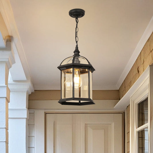 Modern black metal hanging lantern light enhancing elegant front porch decor with warm ambient lighting.